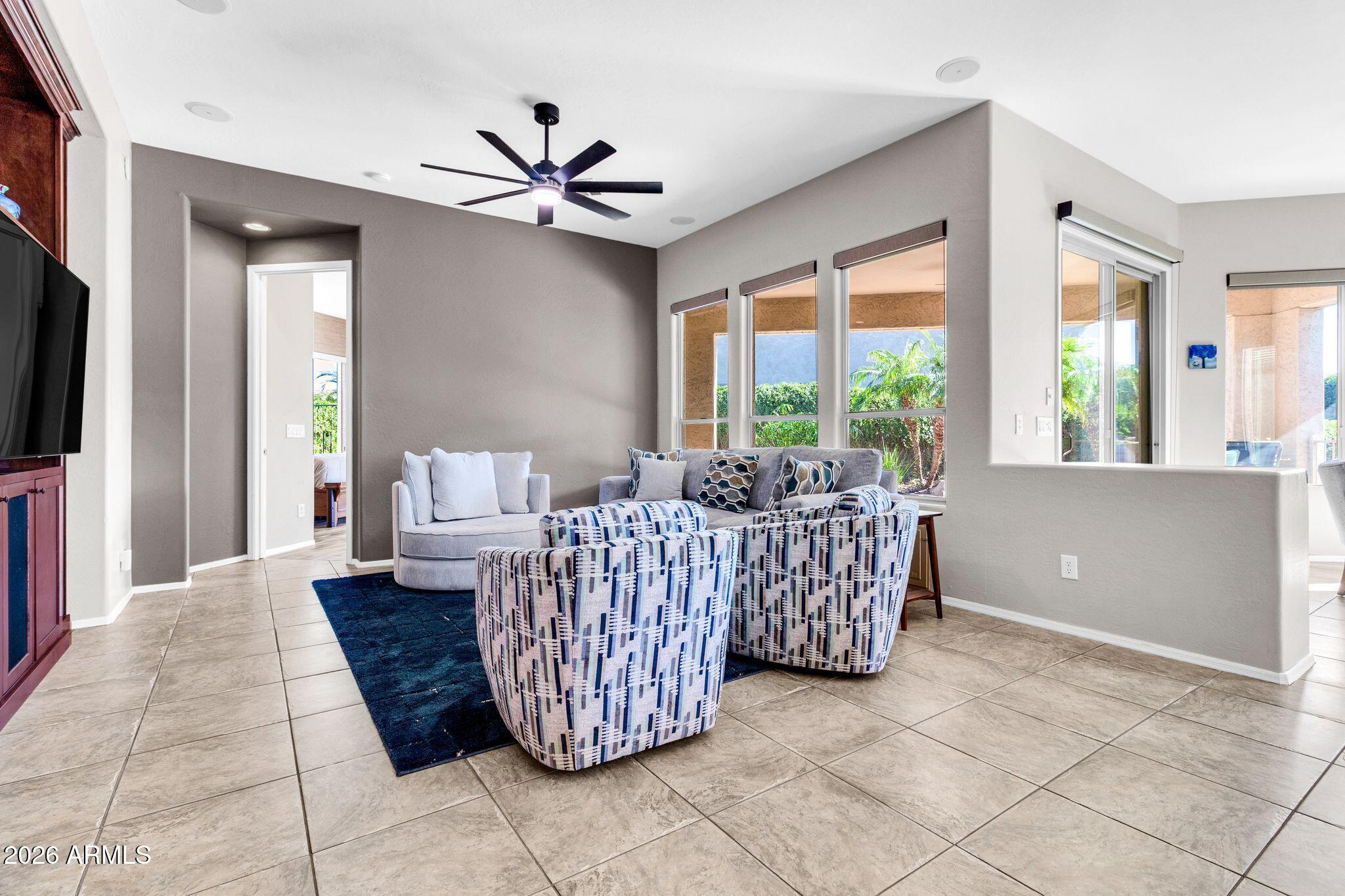 5333 South Marigold Way Gilbert, AZ 85298 - Photo 15 of 69 a living room with furniture and a flat screen tv