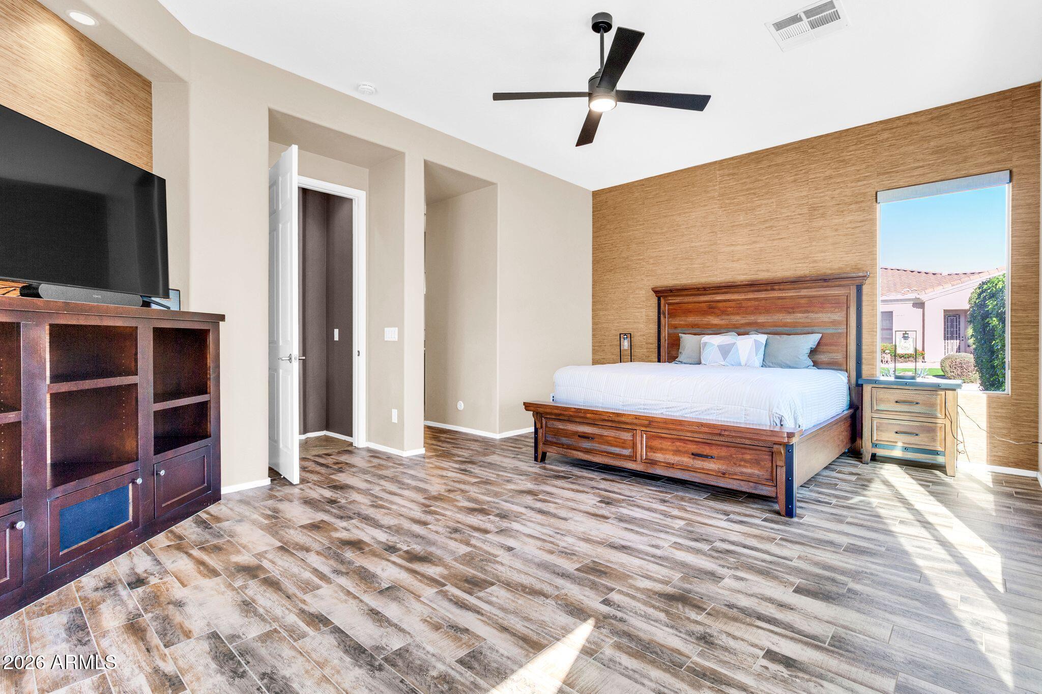 5333 South Marigold Way Gilbert, AZ 85298 - Photo 18 of 69 a bedroom with a bed and a flat screen tv