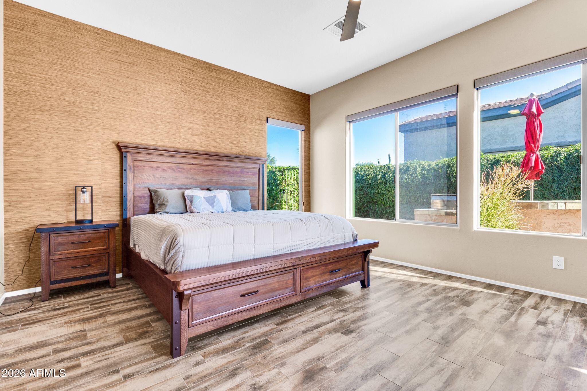 5333 South Marigold Way Gilbert, AZ 85298 - Photo 19 of 69 a bed sitting in a bedroom next to a window