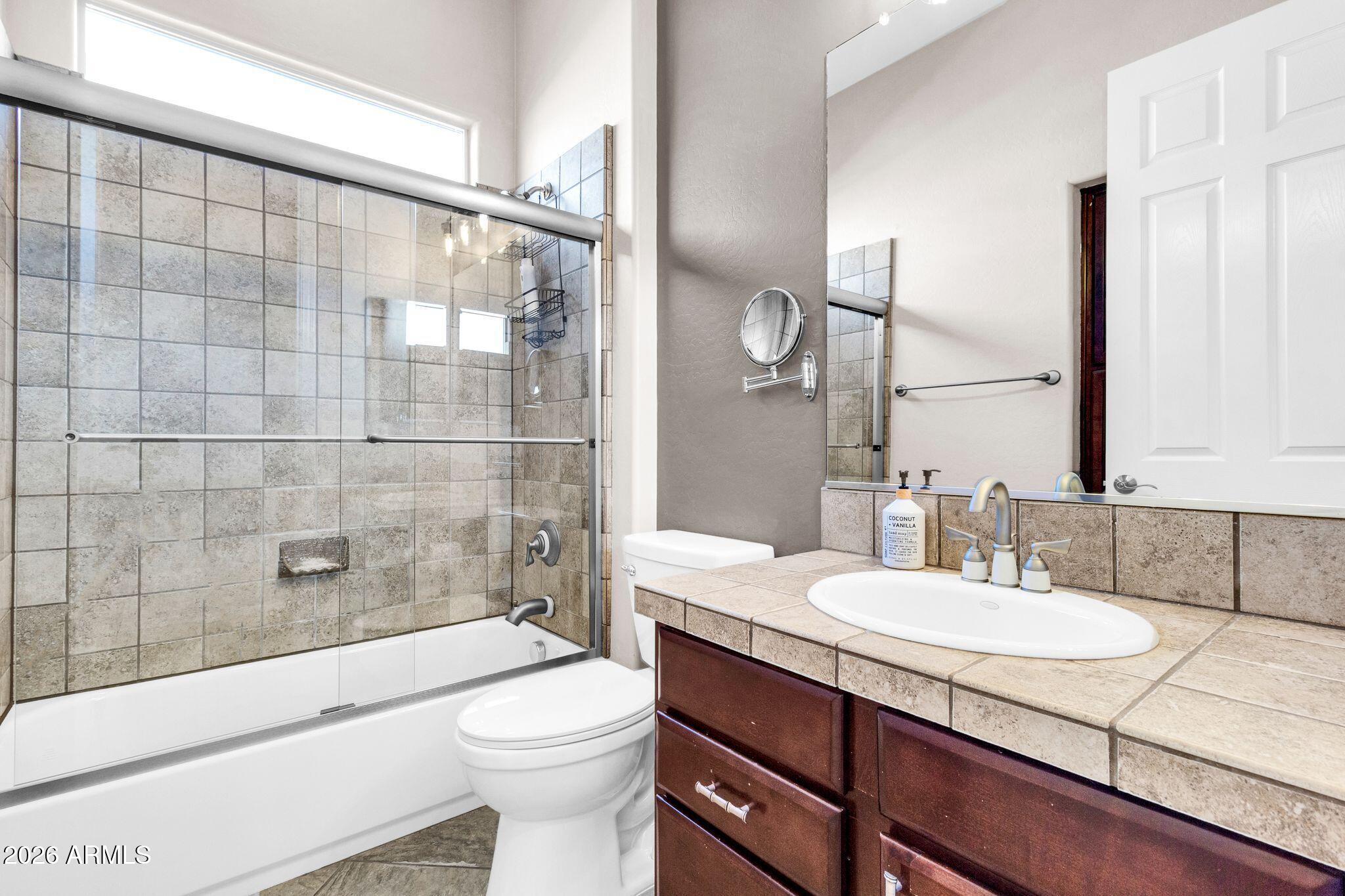 5333 South Marigold Way Gilbert, AZ 85298 - Photo 26 of 69 a bathroom with a sink a toilet and shower