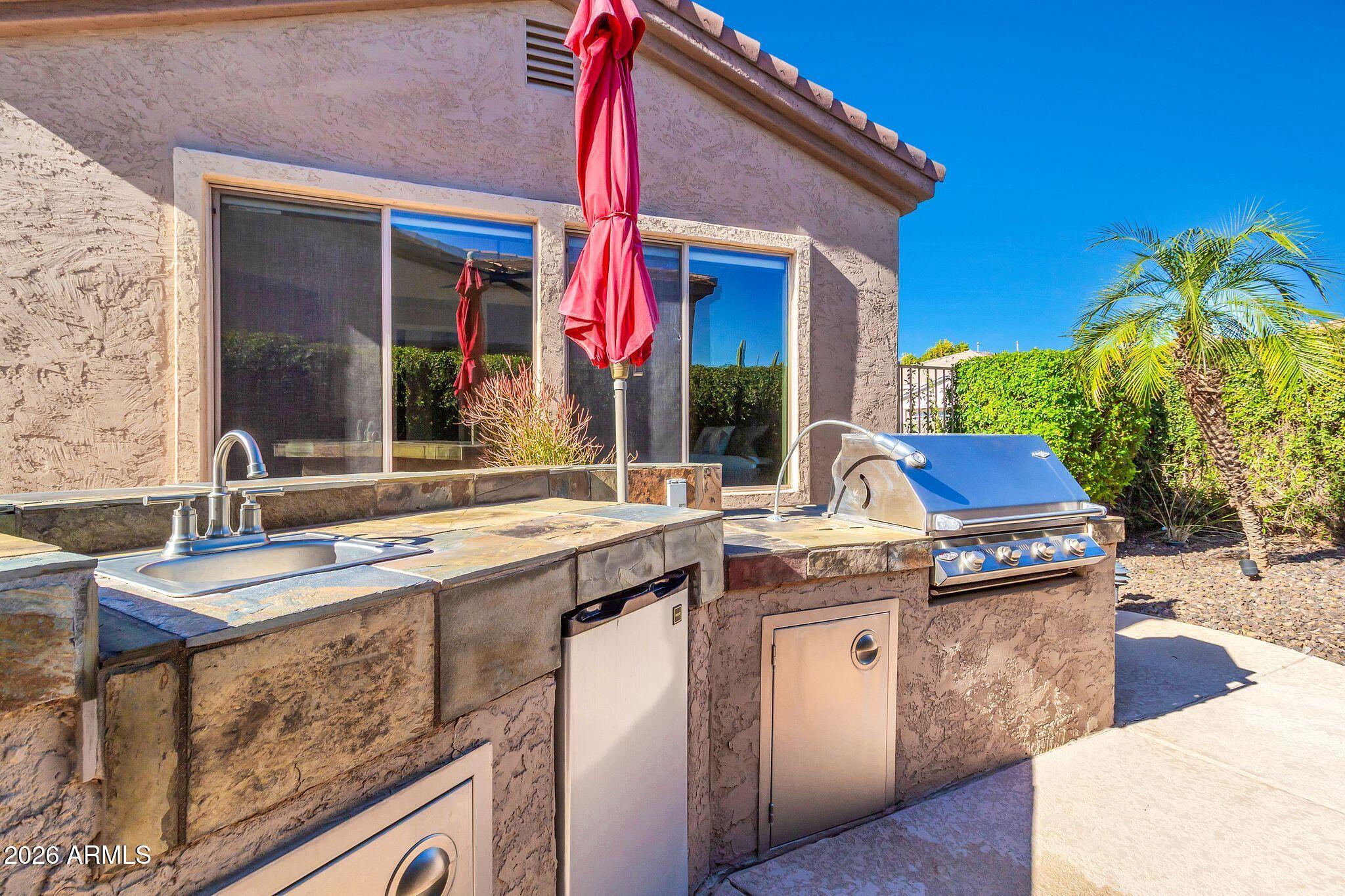 5333 South Marigold Way Gilbert, AZ 85298 - Photo 36 of 69 a view of outdoor kitchen and kitchen
