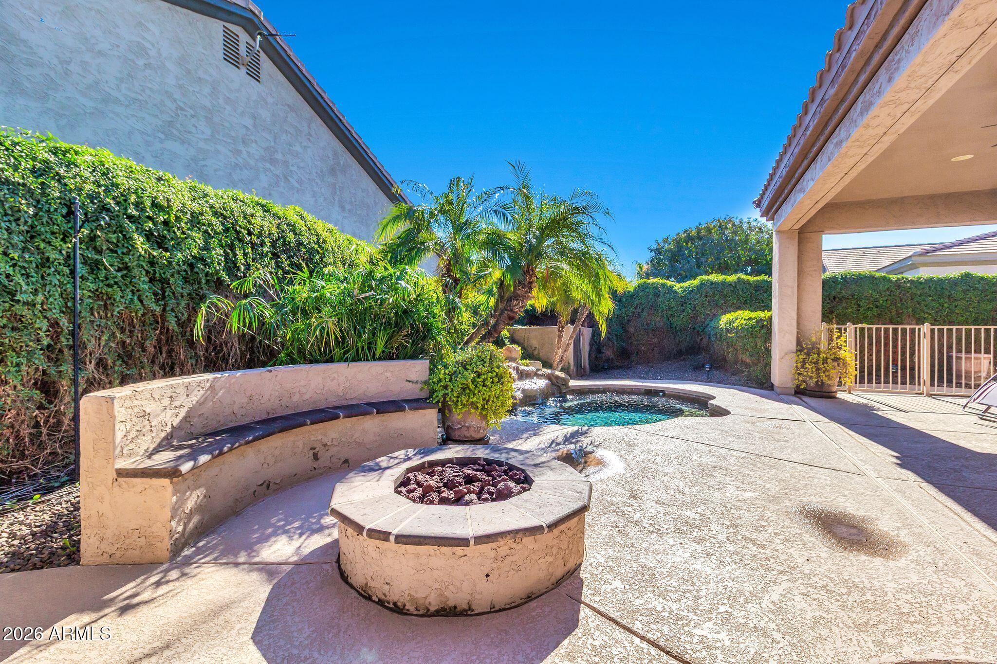 5333 South Marigold Way Gilbert, AZ 85298 - Photo 38 of 69 a view of a backyard with table and chairs potted plants