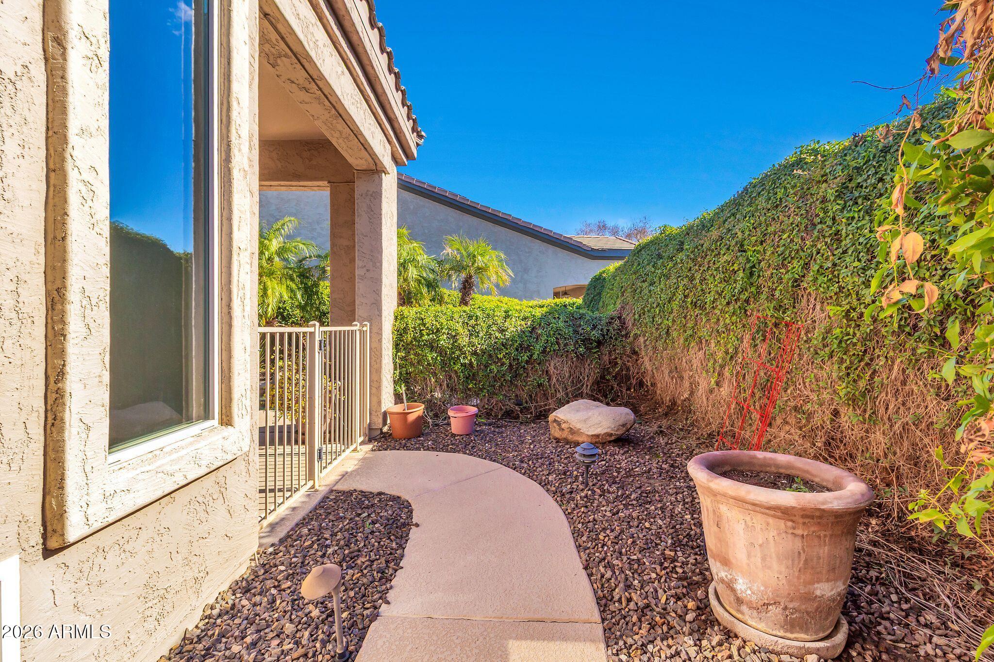 5333 South Marigold Way Gilbert, AZ 85298 - Photo 40 of 69 a view of a patio with couple of chairs and a potted plant