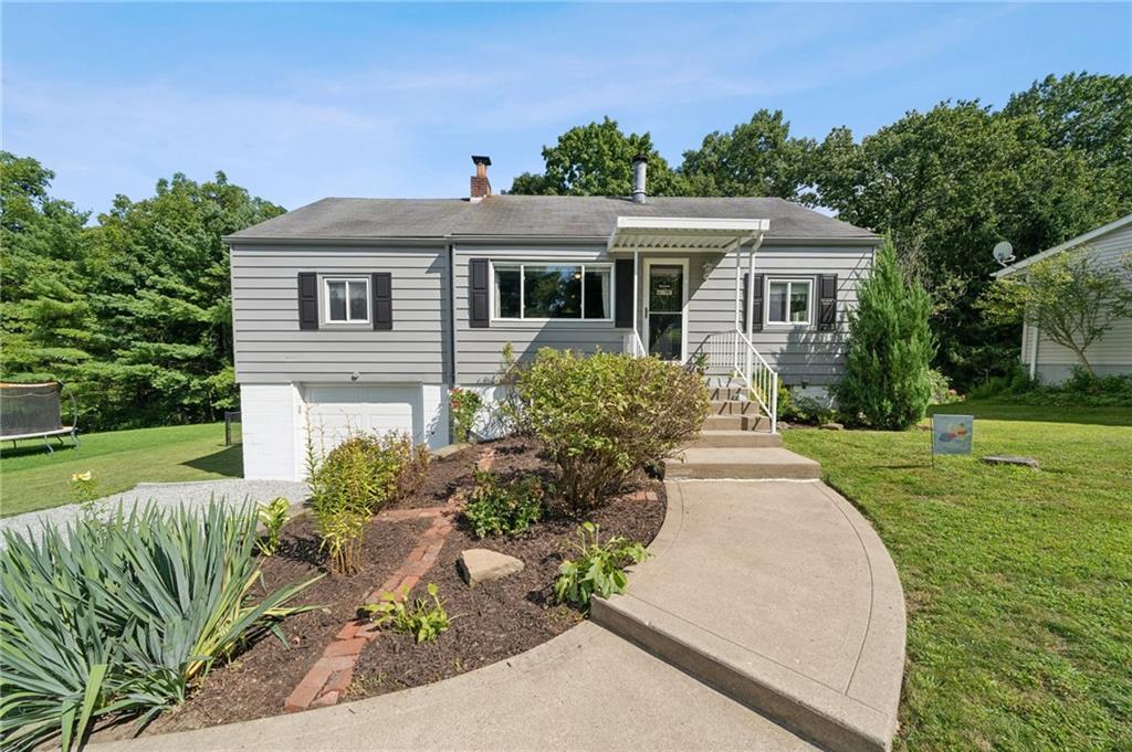 401 Finley Road Pittsburgh, PA 15239 - Photo 1 of 35 a front view of a house with a yard