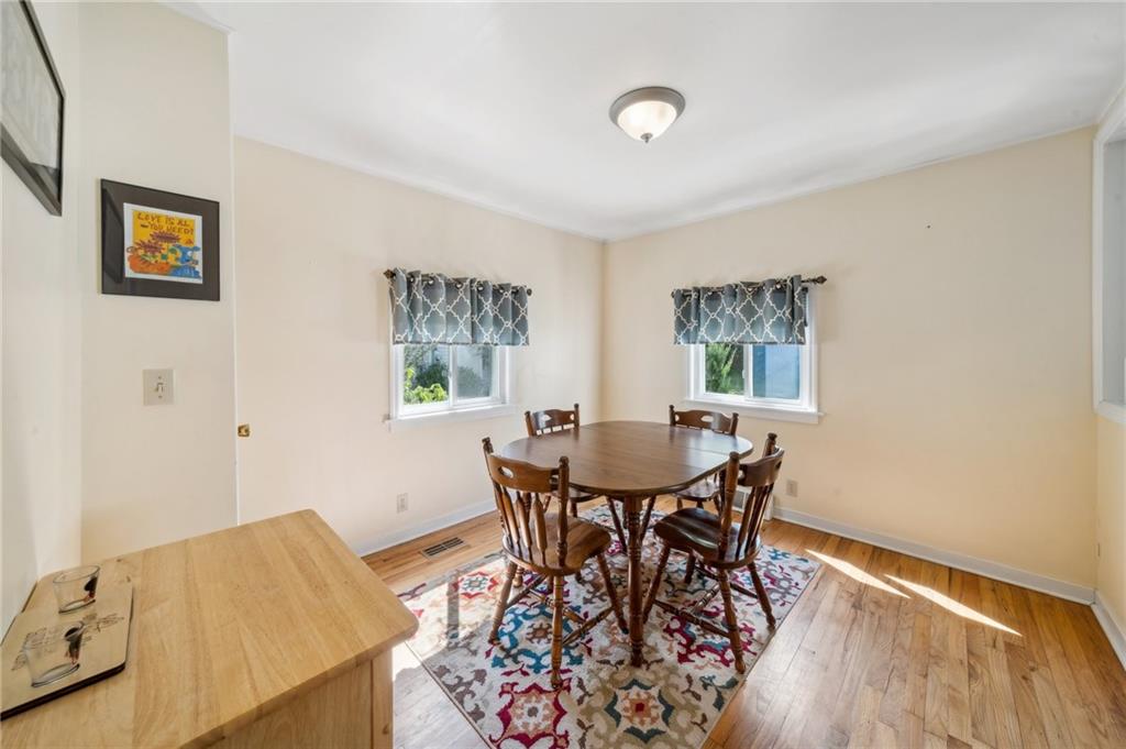 401 Finley Road Pittsburgh, PA 15239 - Photo 11 of 35 a view of a dining room with furniture and wooden floor