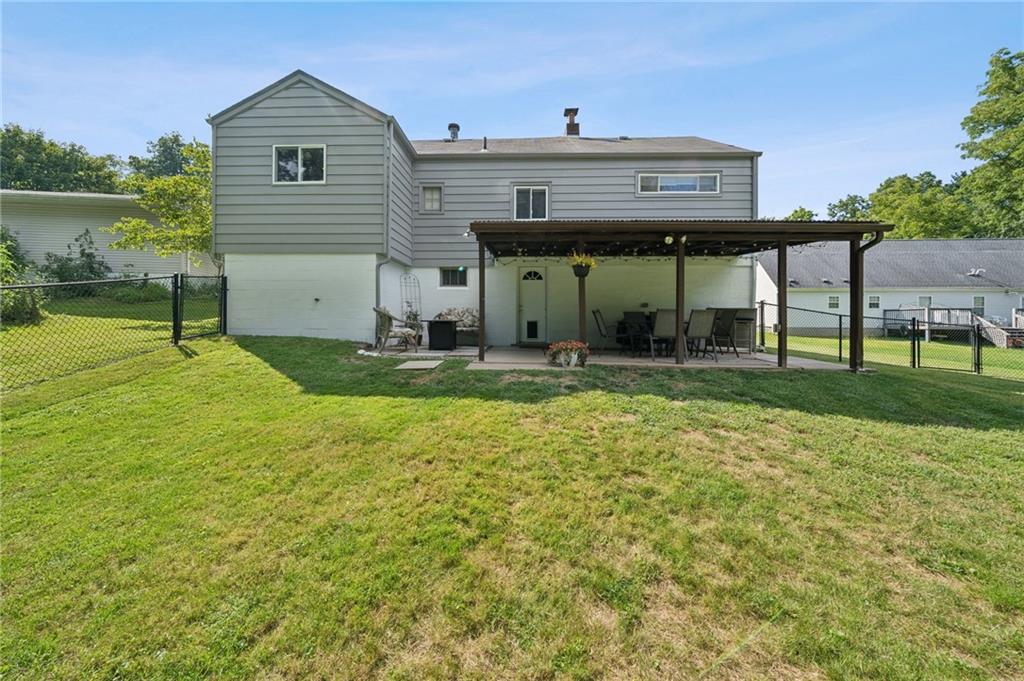 401 Finley Road Pittsburgh, PA 15239 - Photo 31 of 35 a view of a house with a yard and sitting area