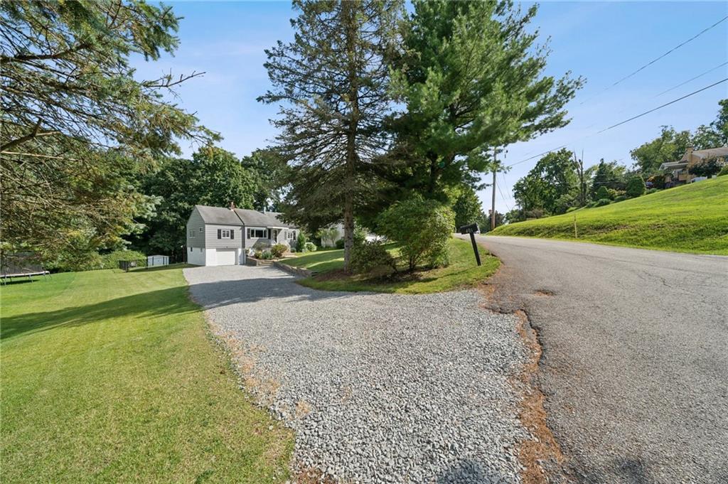 401 Finley Road Pittsburgh, PA 15239 - Photo 35 of 35 a front view of a house with garden