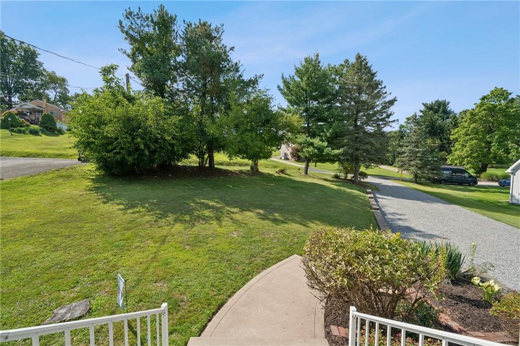 401 Finley Road Pittsburgh, PA 15239 - Photo 4 of 35 a view of a garden with a building in the background