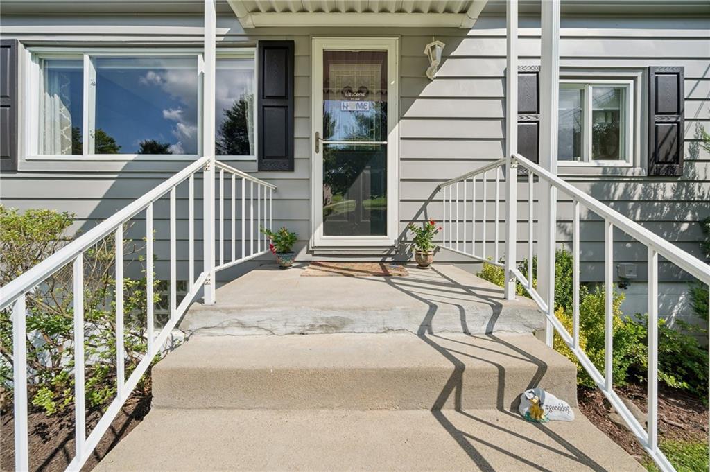 401 Finley Road Pittsburgh, PA 15239 - Photo 5 of 35 a view of a balcony with wooden floor and iron stairs