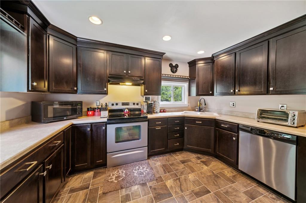 401 Finley Road Pittsburgh, PA 15239 - Photo 8 of 35 a kitchen with a sink stove and oven