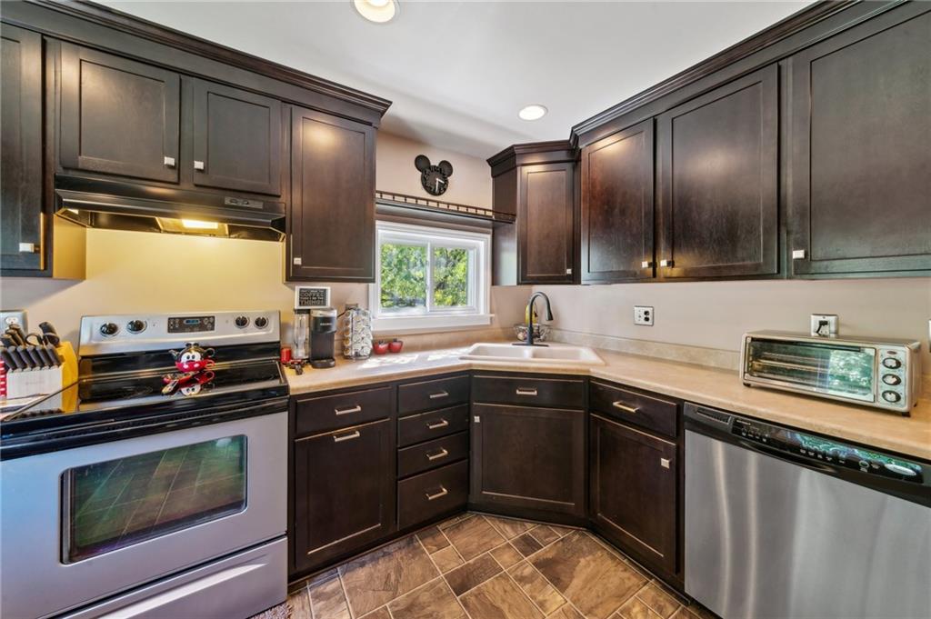 401 Finley Road Pittsburgh, PA 15239 - Photo 9 of 35 a kitchen with a sink stove and microwave