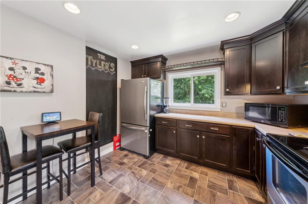 401 Finley Road Pittsburgh, PA 15239 - Photo 10 of 35 a kitchen with stainless steel appliances granite countertop a refrigerator and a sink