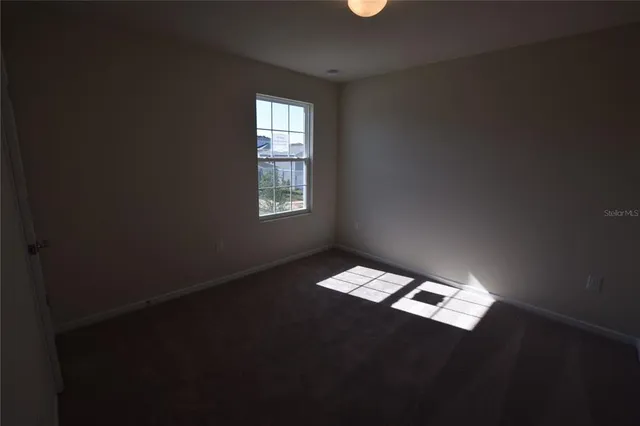 a close view of an empty room with a window