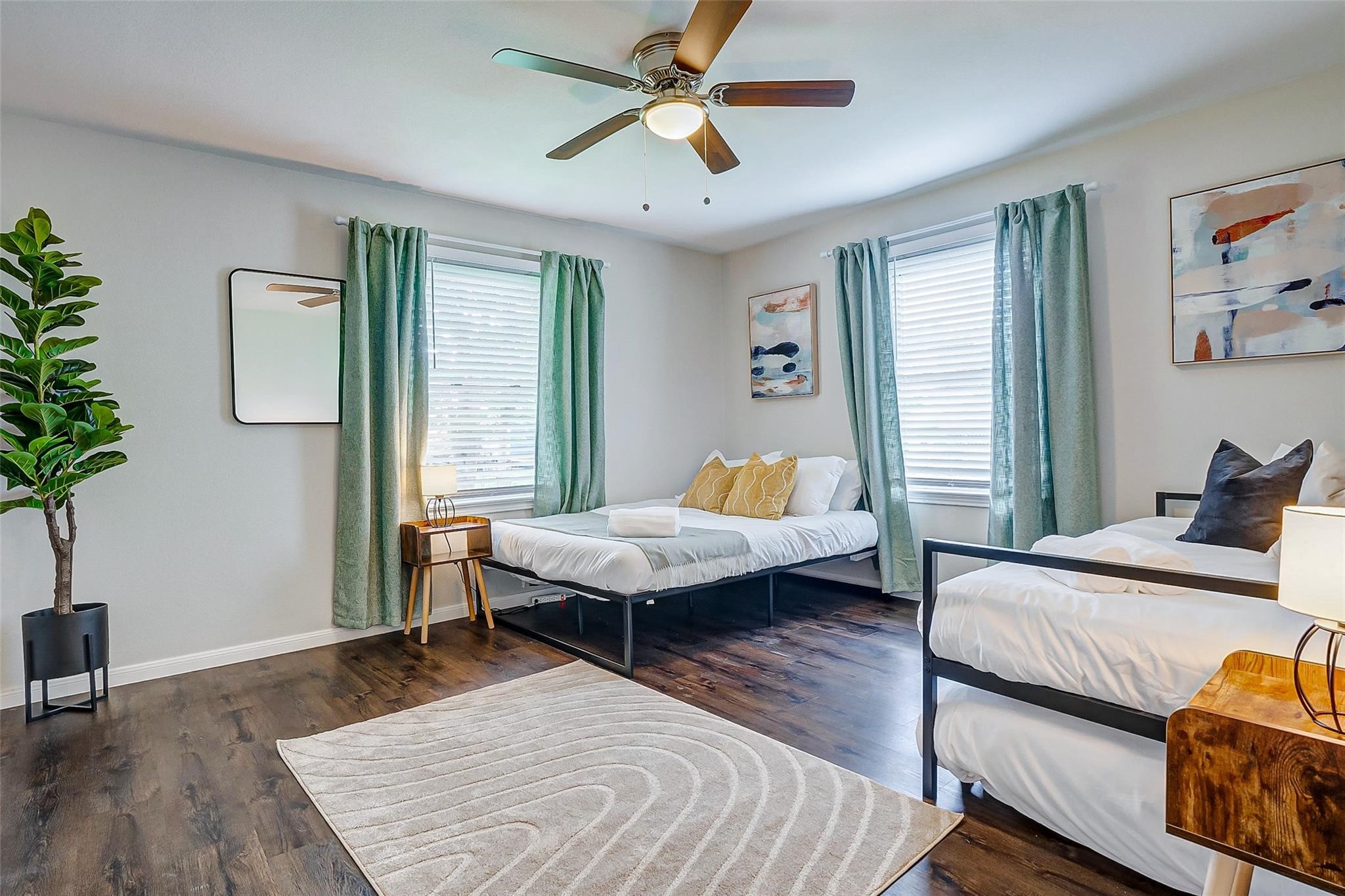 4440 Castor Street Houston, TX 77022 - Photo 13 of 30 a bedroom with a bed wooden floor and window