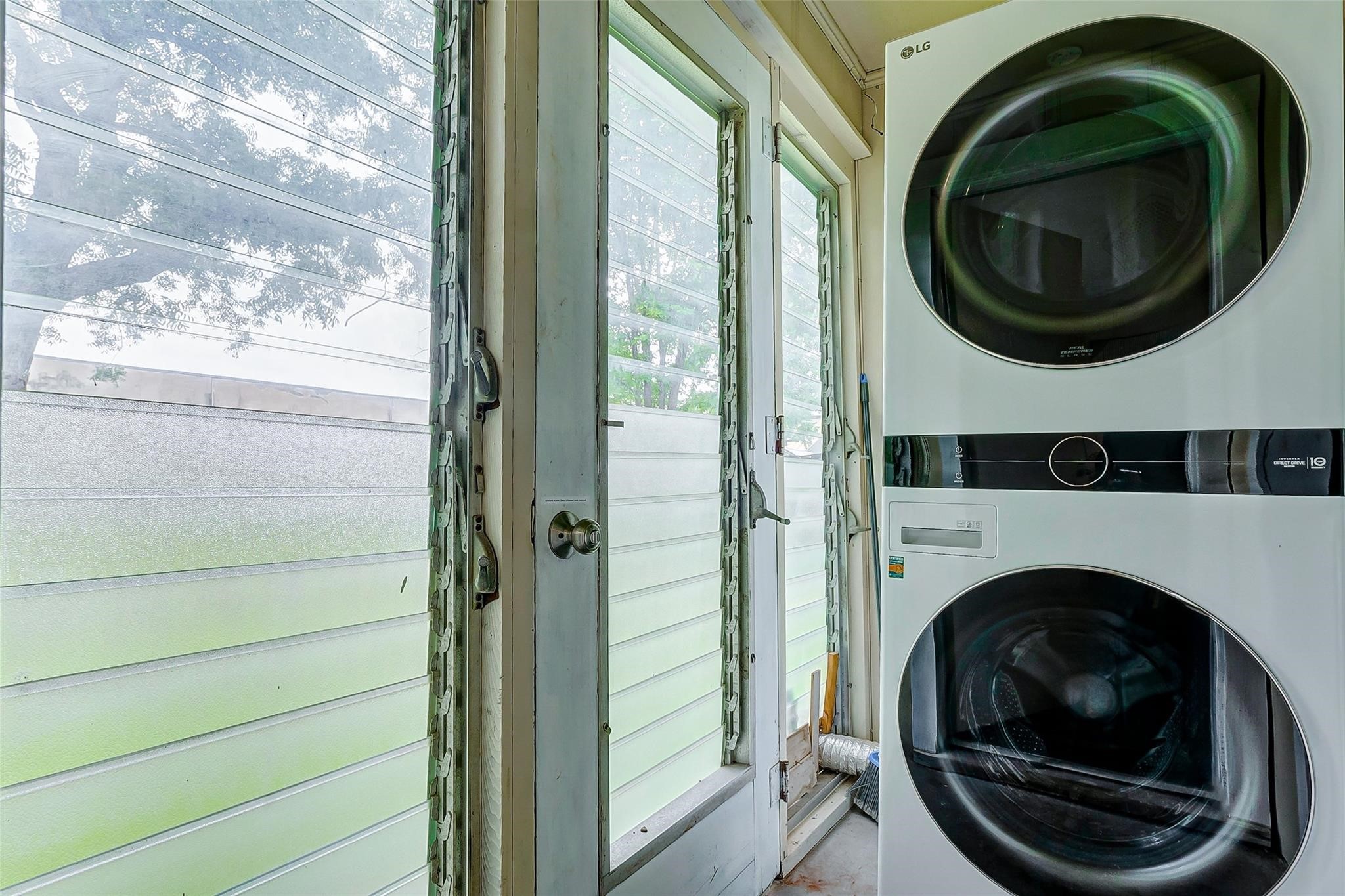 4440 Castor Street Houston, TX 77022 - Photo 15 of 30 a view of a hallway with washer and dryer