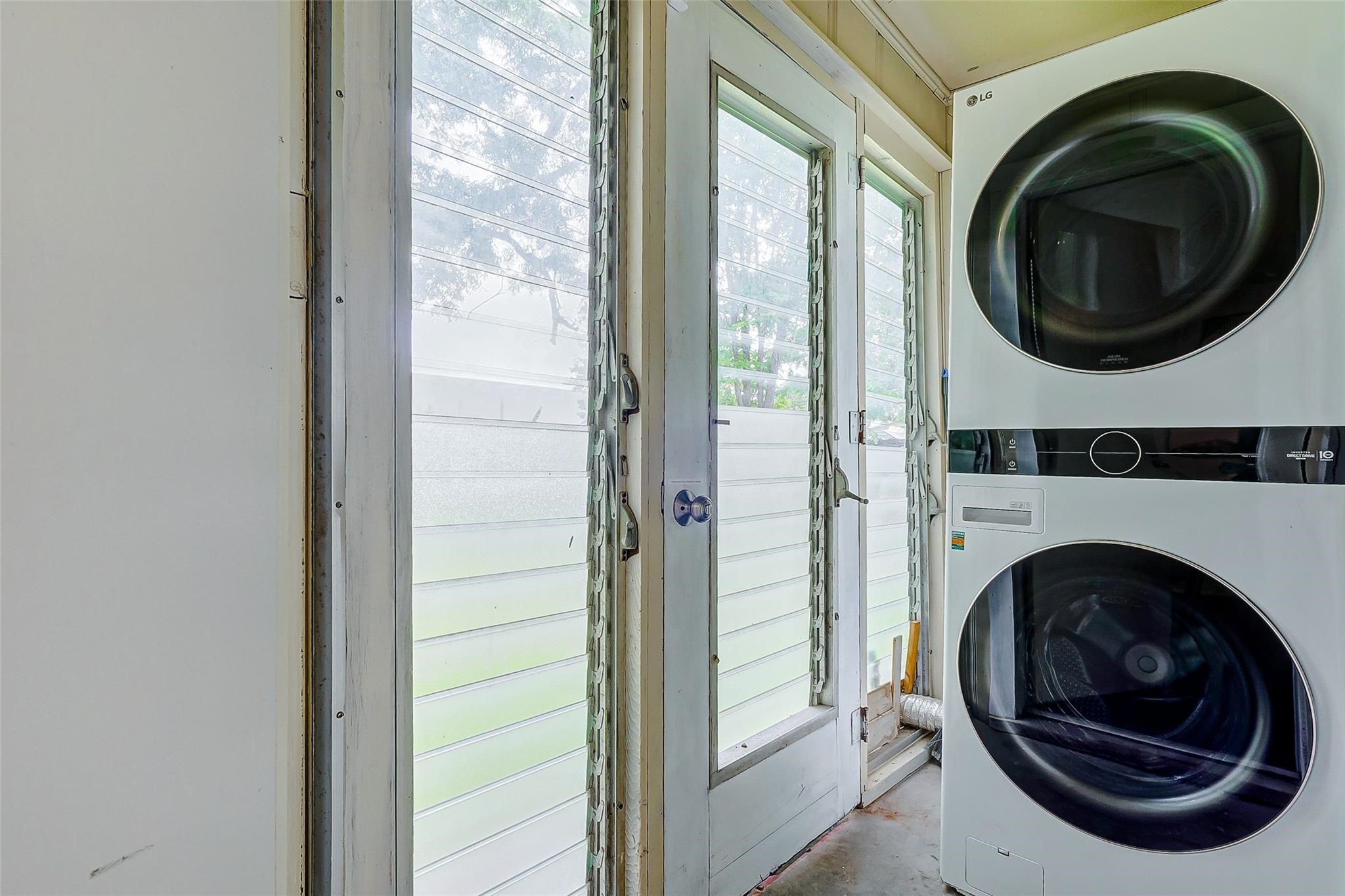4440 Castor Street Houston, TX 77022 - Photo 16 of 30 a view of a hallway with washer and dryer