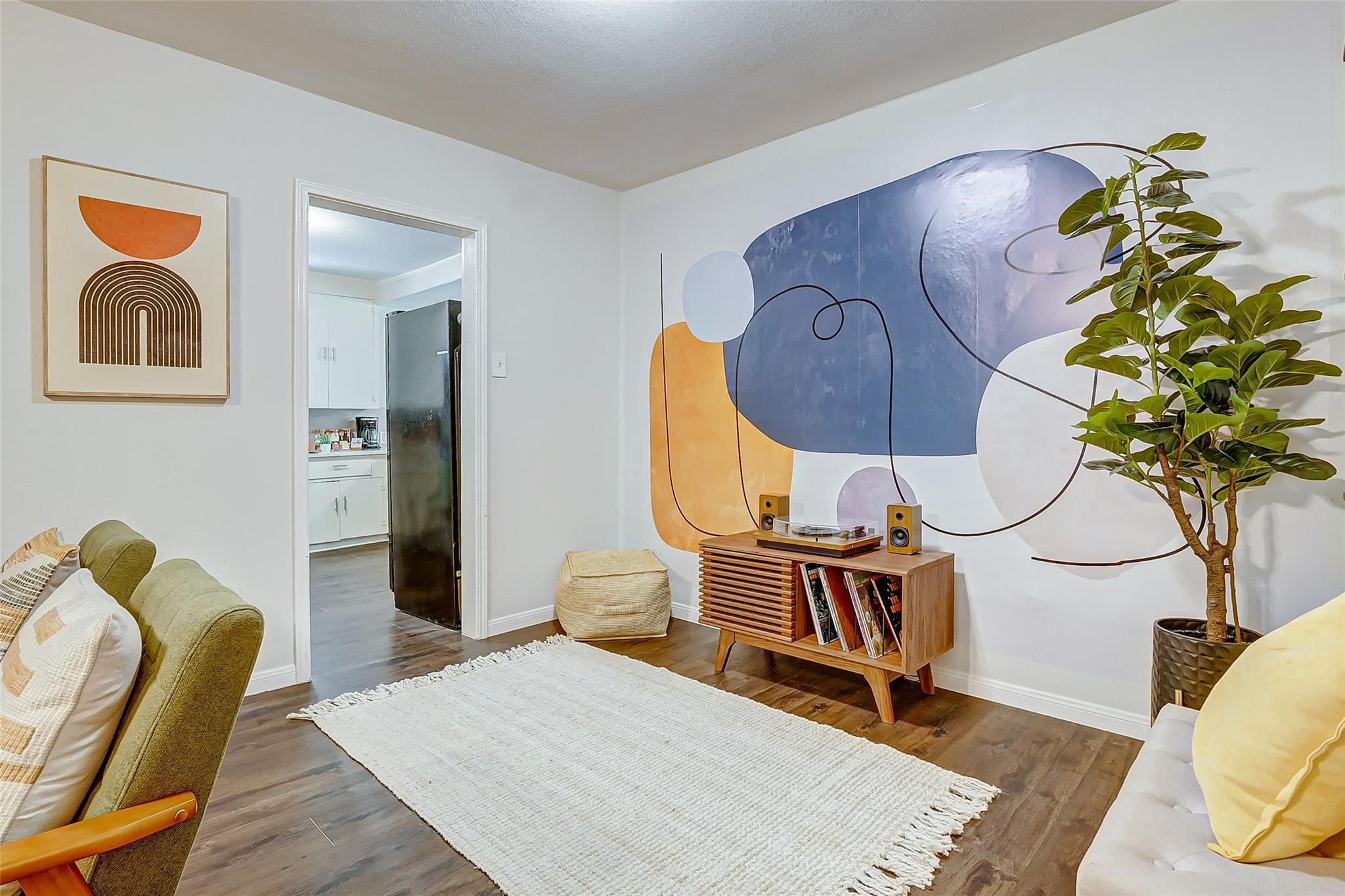 4440 Castor Street Houston, TX 77022 - Photo 22 of 30 a living room with furniture flowers and wooden floor