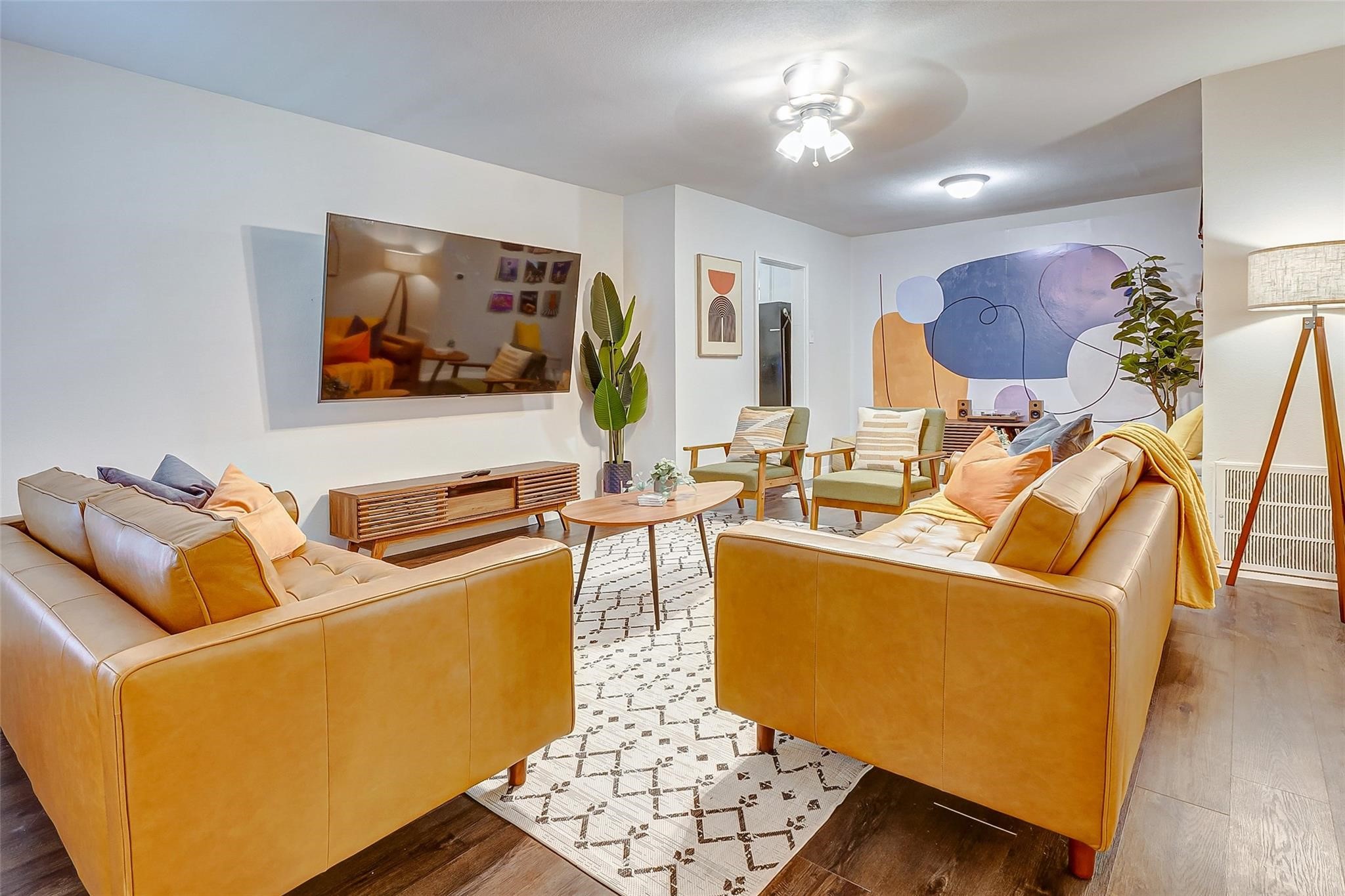 4440 Castor Street Houston, TX 77022 - Photo 24 of 30 a living room with furniture and a flat screen tv