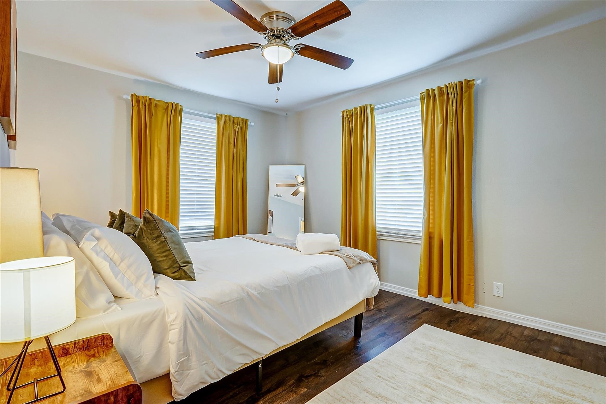 4440 Castor Street Houston, TX 77022 - Photo 8 of 30 a bedroom with a bed and a chandelier