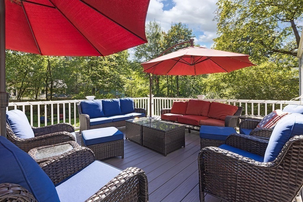 65 Rokeby Road Newton, MA 02468 - Photo 12 of 13 a view of a deck with furniture and a yard