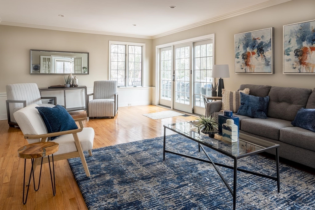 65 Rokeby Road Newton, MA 02468 - Photo 3 of 13 a living room with furniture fireplace and a large window