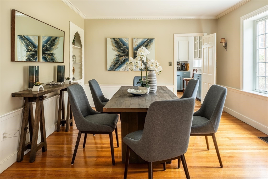 65 Rokeby Road Newton, MA 02468 - Photo 4 of 13 a view of a dining room with furniture window and wooden floor
