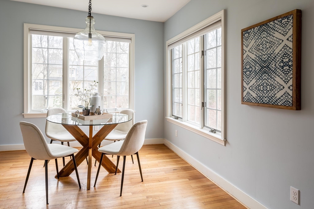 65 Rokeby Road Newton, MA 02468 - Photo 6 of 13 a view of a dining room with furniture wooden floor and a chandelier
