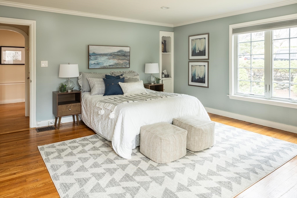 65 Rokeby Road Newton, MA 02468 - Photo 8 of 13 a spacious bedroom with a bed and a window