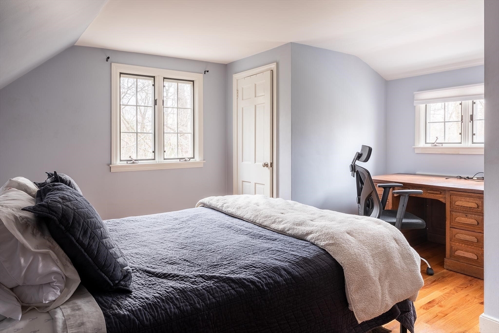 65 Rokeby Road Newton, MA 02468 - Photo 9 of 13 a bedroom with a bed and a fireplace