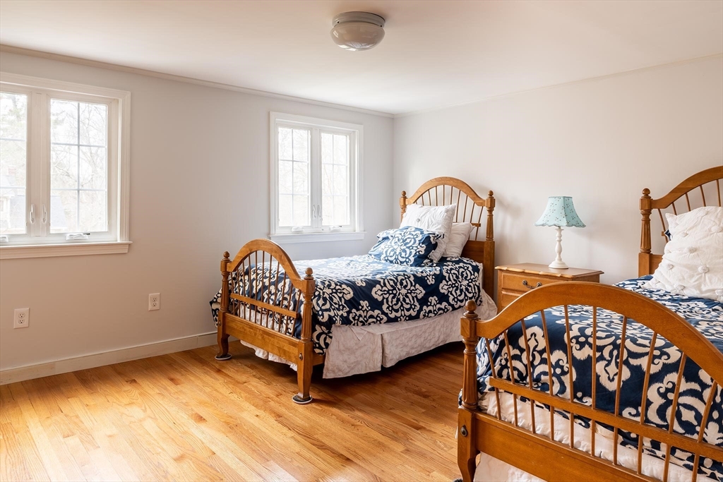 65 Rokeby Road Newton, MA 02468 - Photo 10 of 13 a bed sitting in a bedroom next to a window