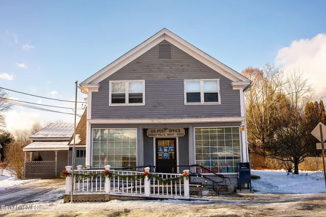 a front view of a house with glass windows