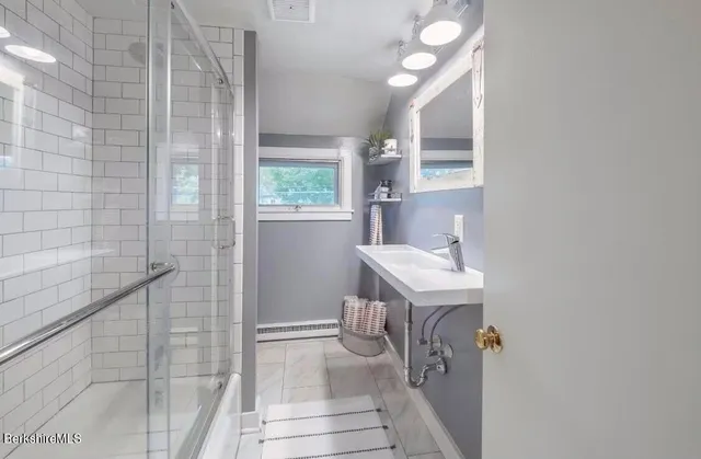 a bathroom with a sink and a mirror