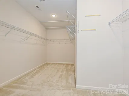 a view of a room with racks on the wall