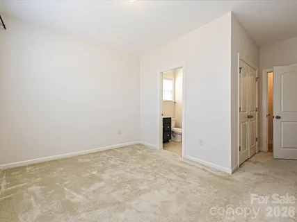 an empty room with closet area