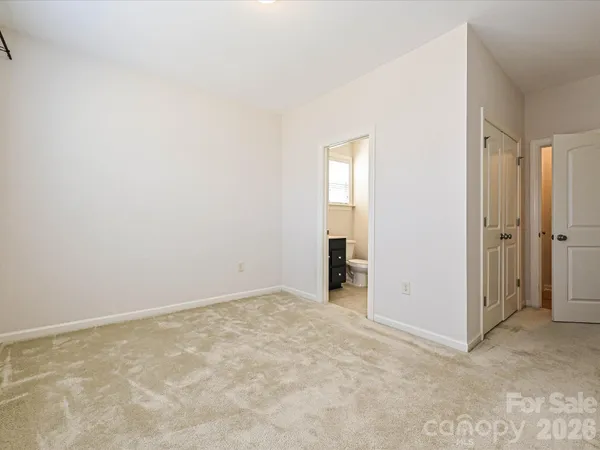 an empty room with closet area