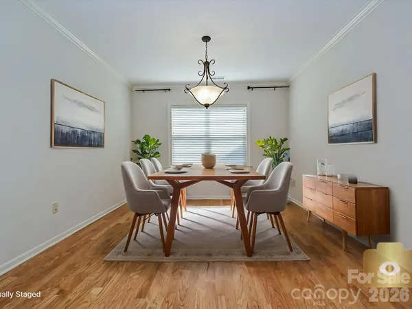 a dining room with furniture window wooden floor