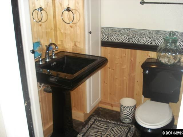 14550 Virginia Foothills Drive Reno, NV 89521 - Photo 8 of 9 a bathroom with a sink a toilet and a shower