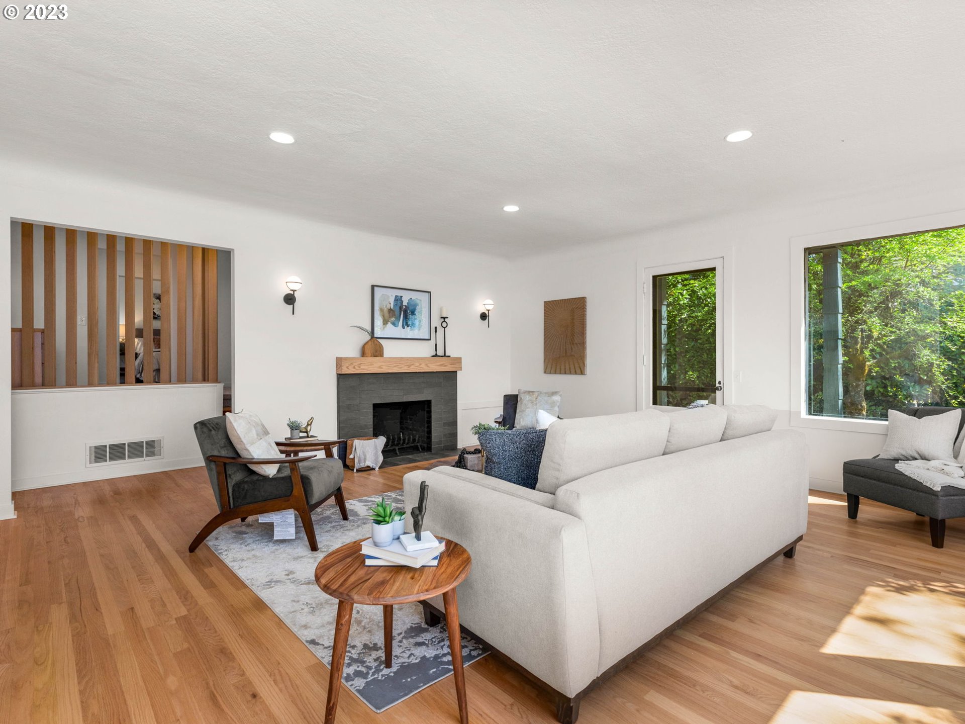 3590 Southwest Patton Road Portland, OR 97221 - Photo 12 of 32 a living room with furniture a fireplace and a large window
