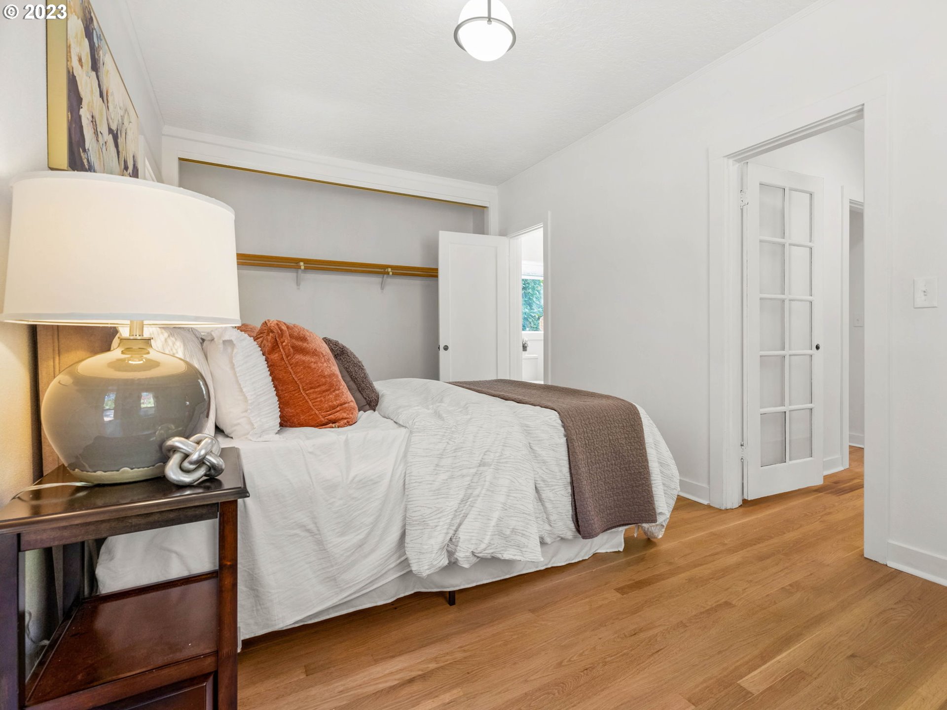 3590 Southwest Patton Road Portland, OR 97221 - Photo 23 of 32 a bedroom with a bed and wooden floor