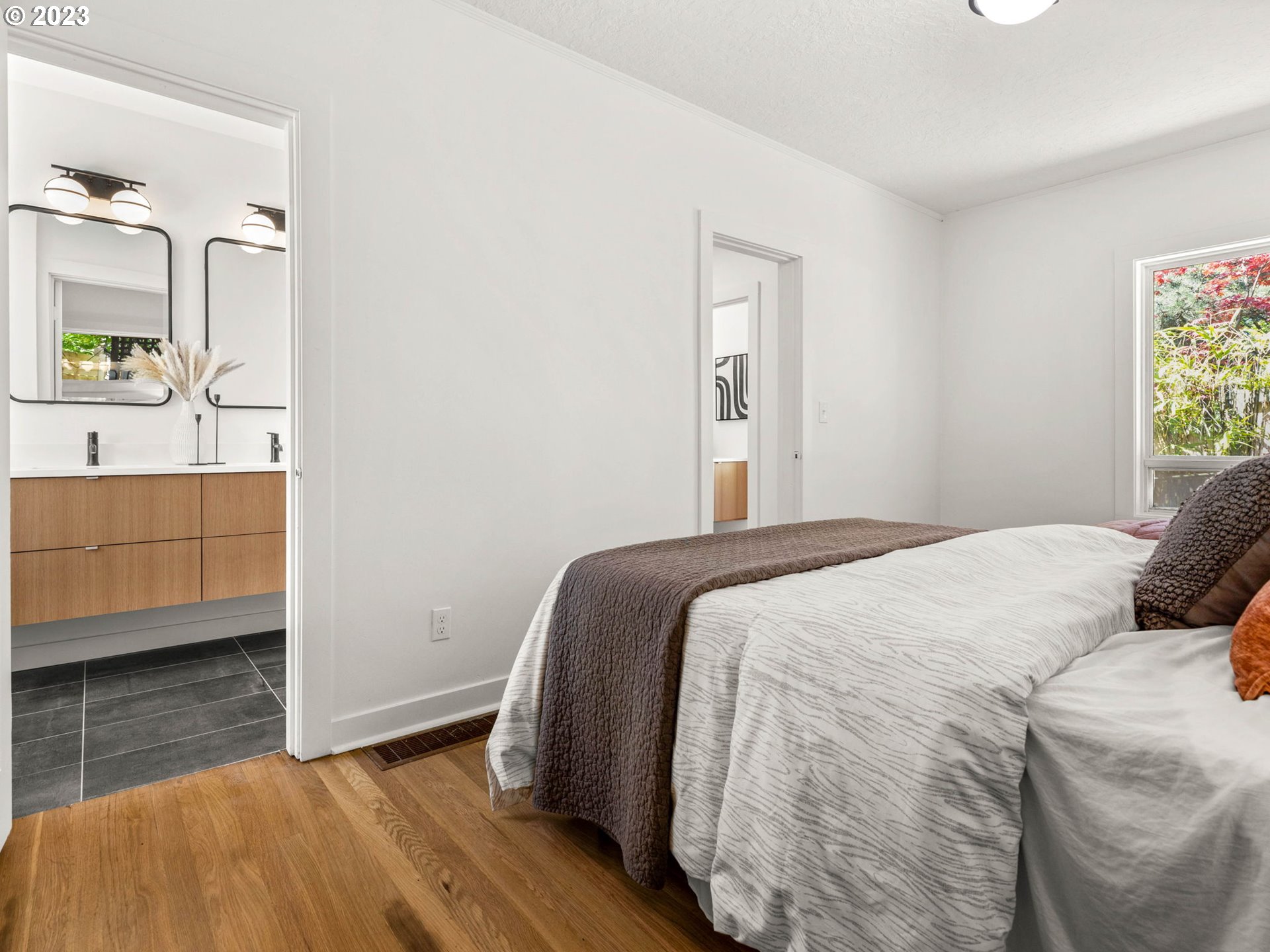 3590 Southwest Patton Road Portland, OR 97221 - Photo 25 of 32 a bedroom with a bed and a dresser