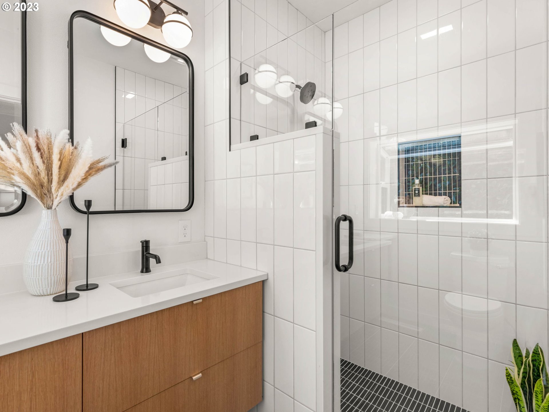 3590 Southwest Patton Road Portland, OR 97221 - Photo 27 of 32 a bathroom with a sink a vanity a mirror and shower