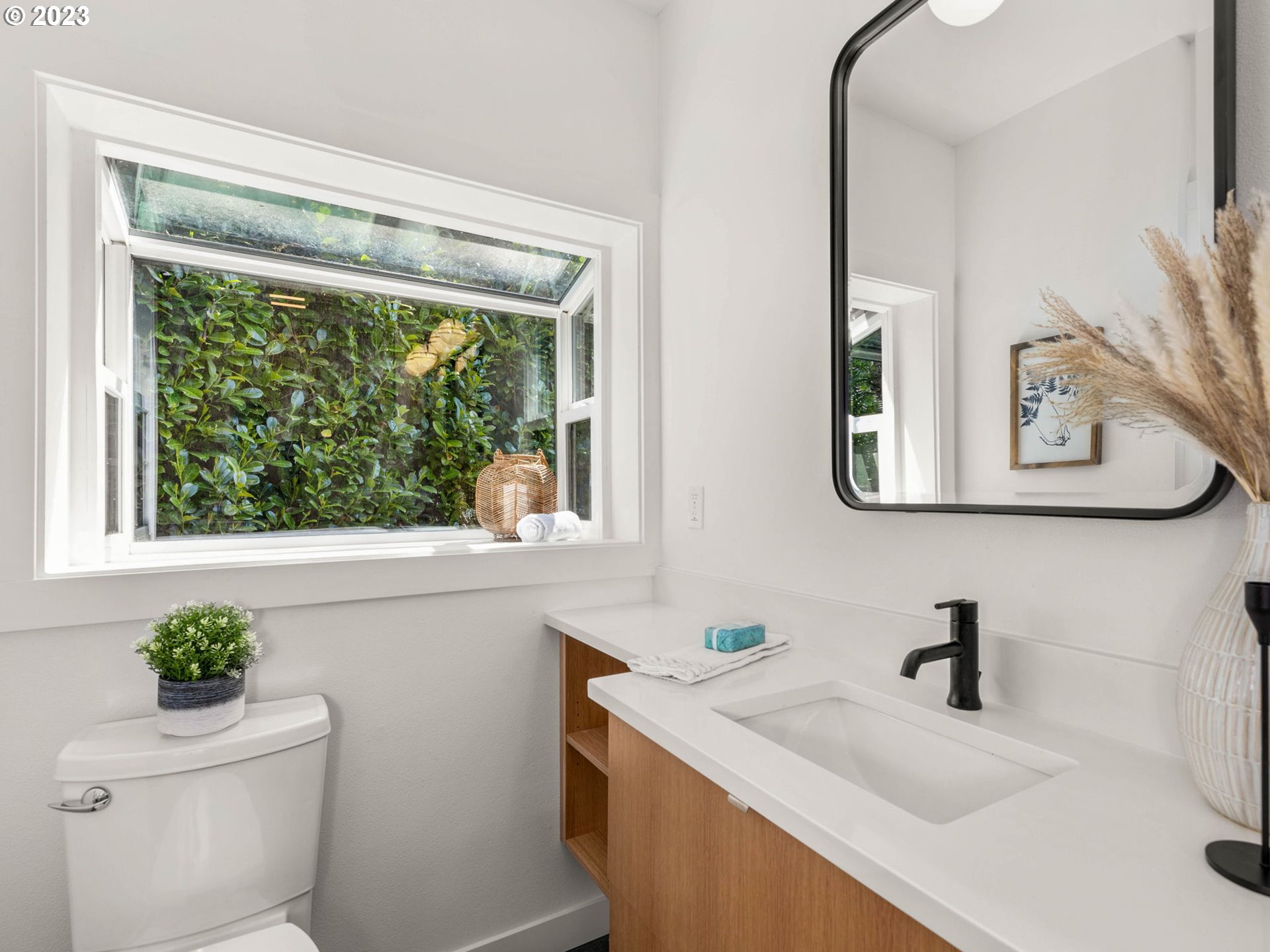 3590 Southwest Patton Road Portland, OR 97221 - Photo 28 of 32 a bathroom with a sink mirror and toilet