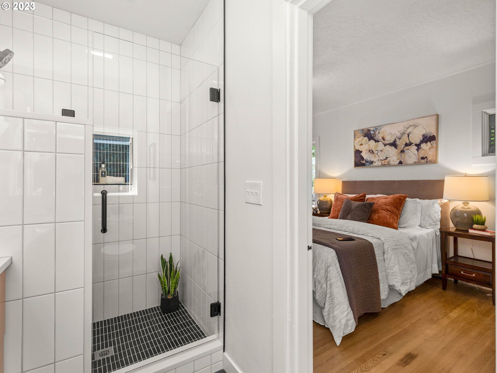 3590 Southwest Patton Road Portland, OR 97221 - Photo 29 of 32 a bed room with a bed and a painting on the wall