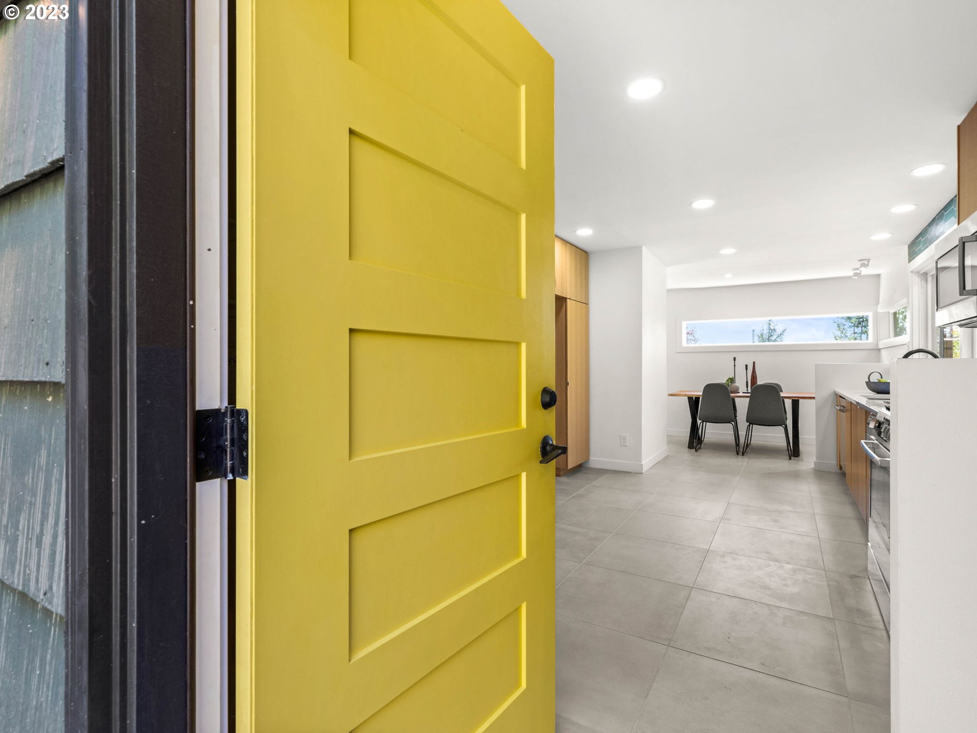 3590 Southwest Patton Road Portland, OR 97221 - Photo 5 of 32 a view of a hallway with furniture and a refrigerator