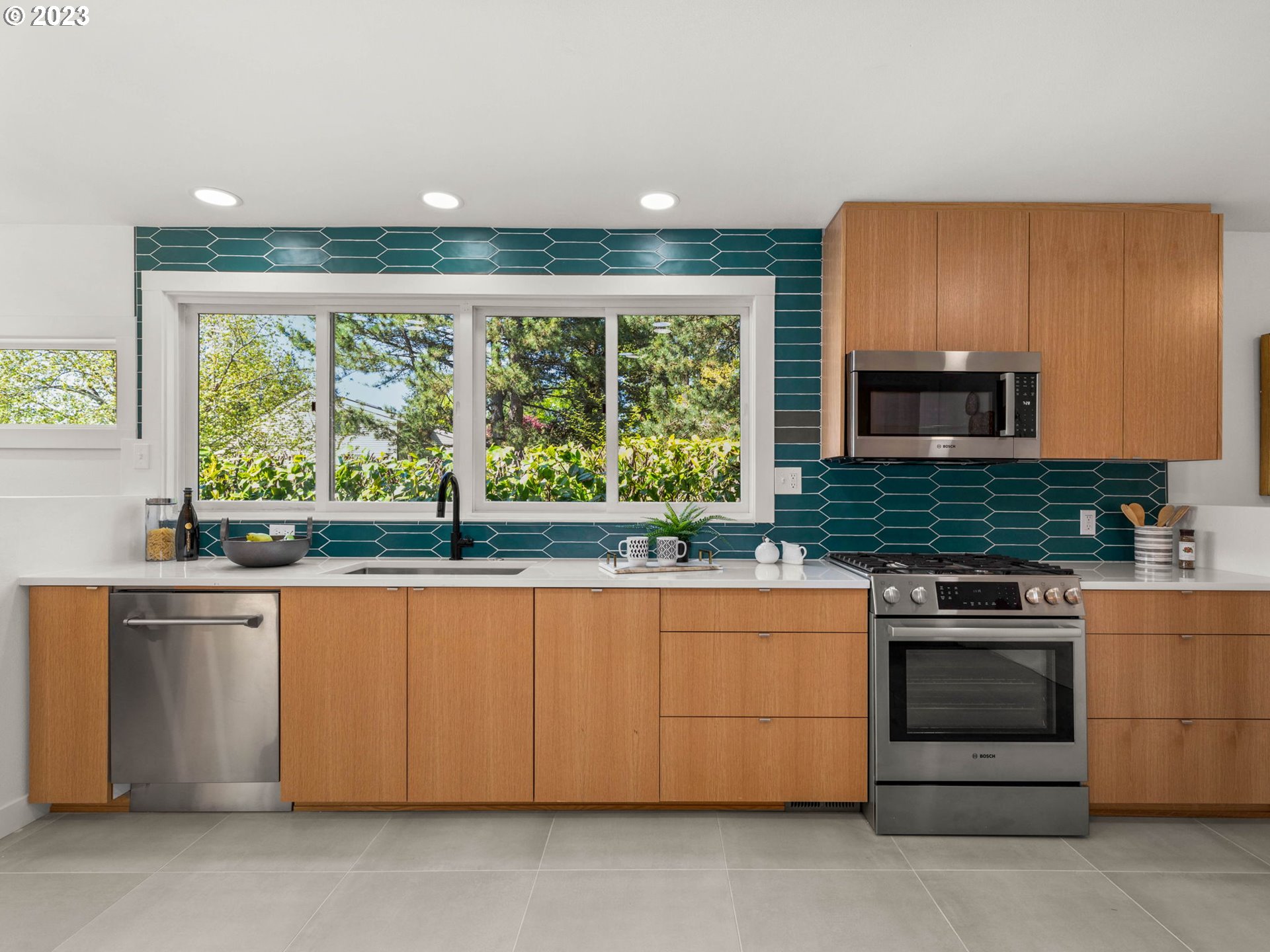 3590 Southwest Patton Road Portland, OR 97221 - Photo 6 of 32 a kitchen with stainless steel appliances a stove and a sink