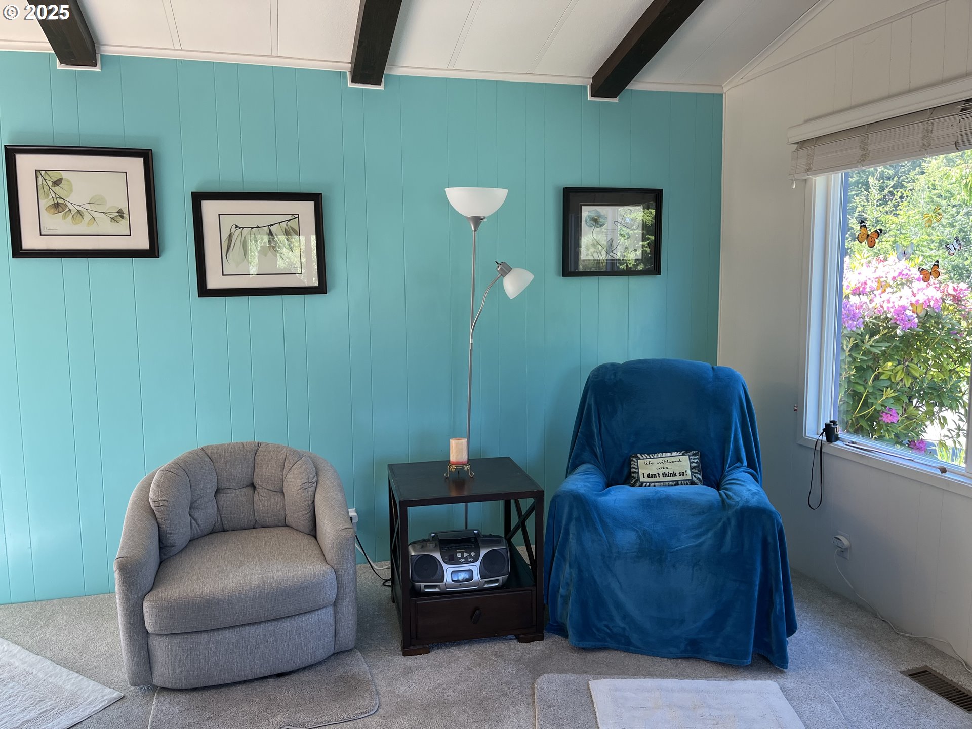 83763 Highway 101, Unit 10 Florence, OR 97439 - Photo 15 of 34 a living room with furniture and a potted plant
