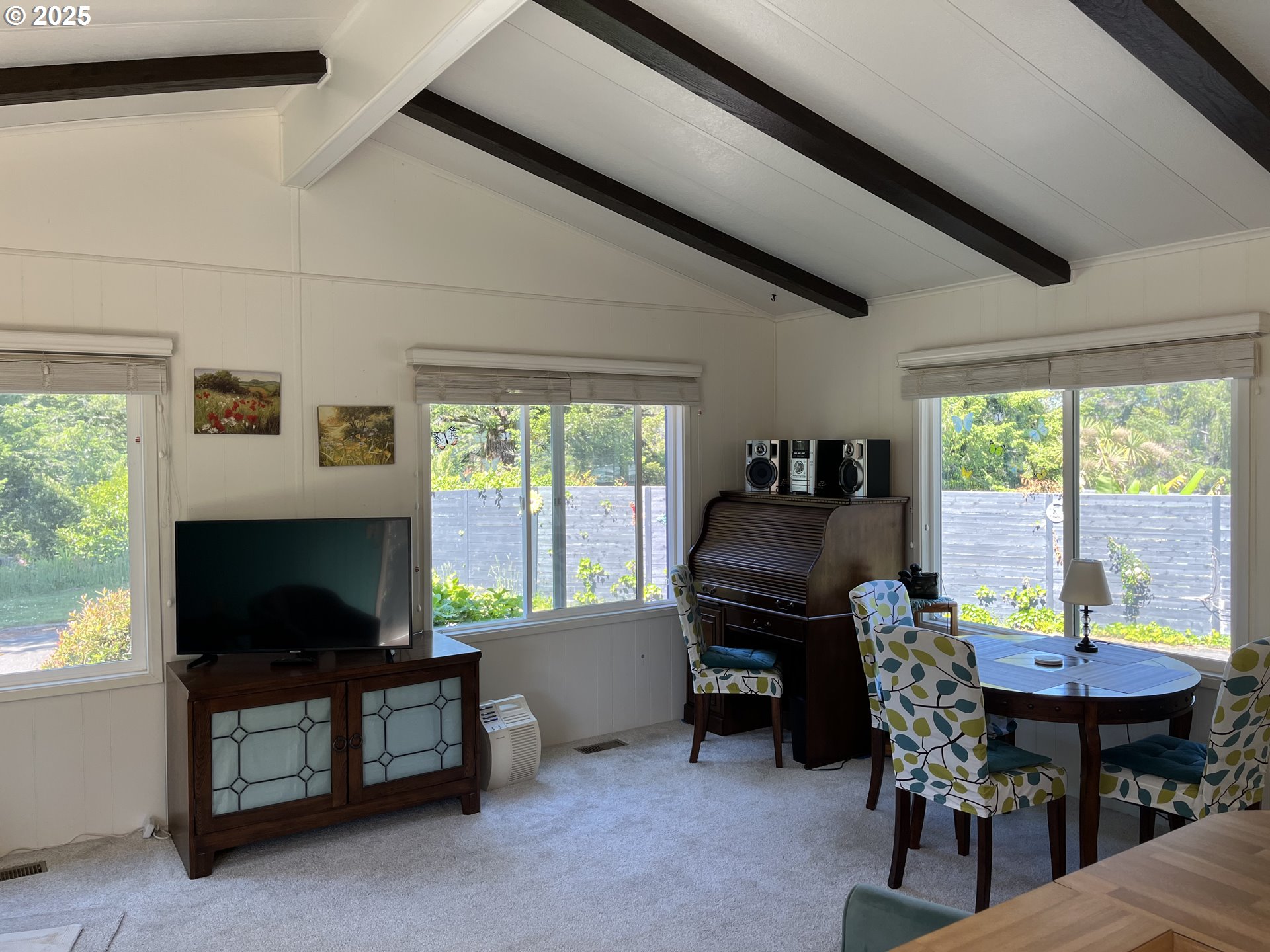 83763 Highway 101, Unit 10 Florence, OR 97439 - Photo 20 of 34 a view of a workspace with furniture and a window