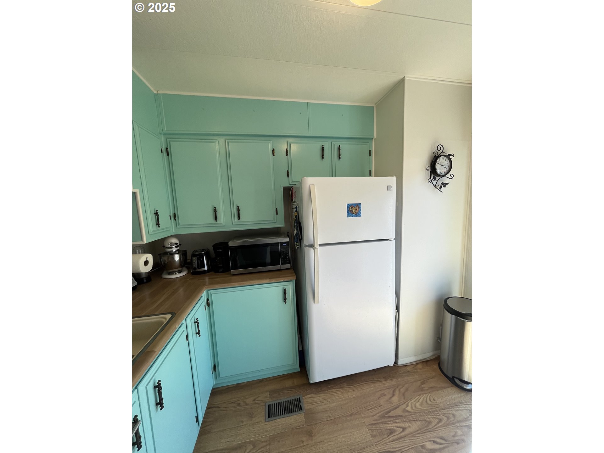 83763 Highway 101, Unit 10 Florence, OR 97439 - Photo 25 of 34 a kitchen with a refrigerator and a stove