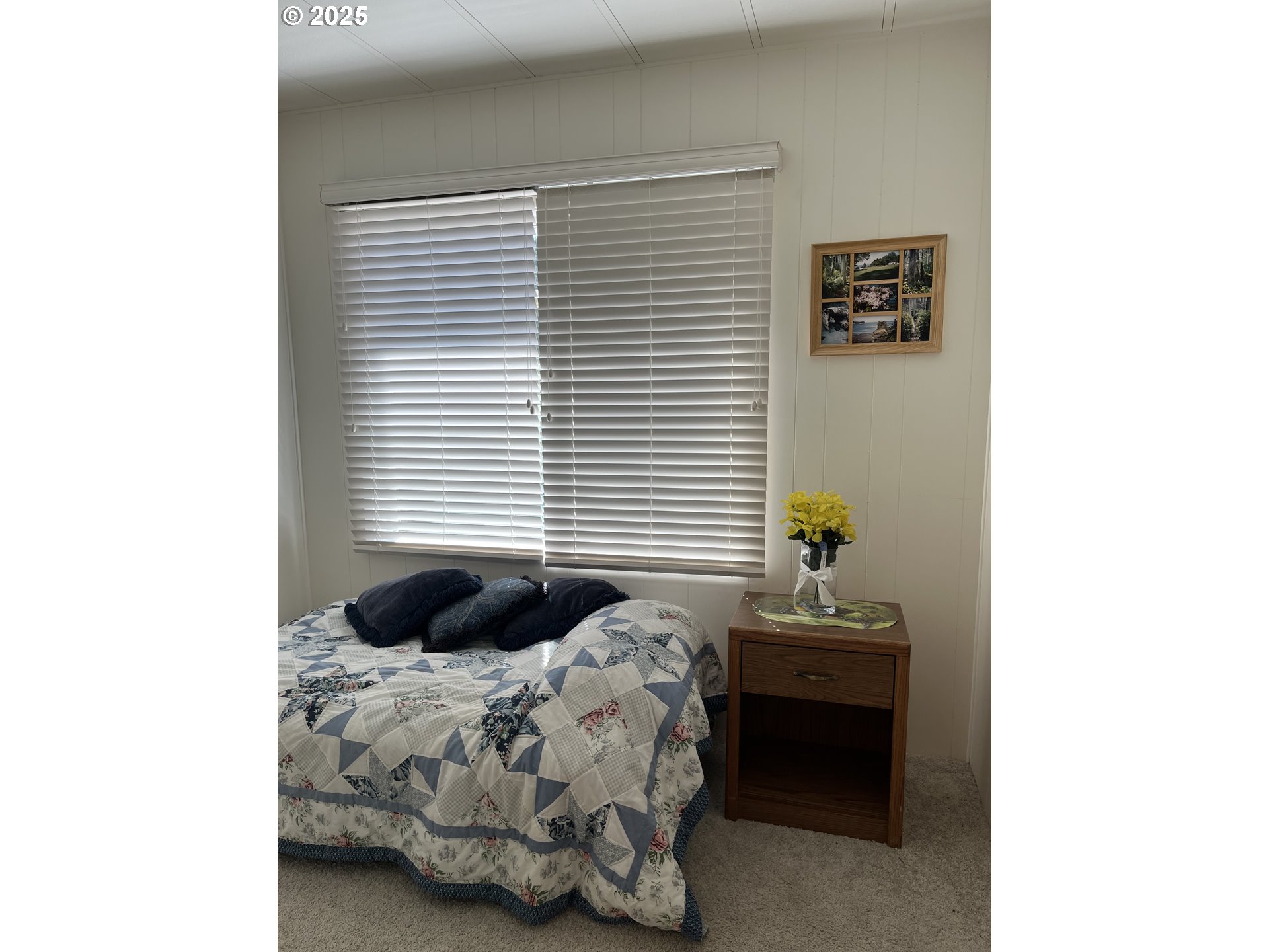 83763 Highway 101, Unit 10 Florence, OR 97439 - Photo 32 of 34 a bedroom with a bed and a window