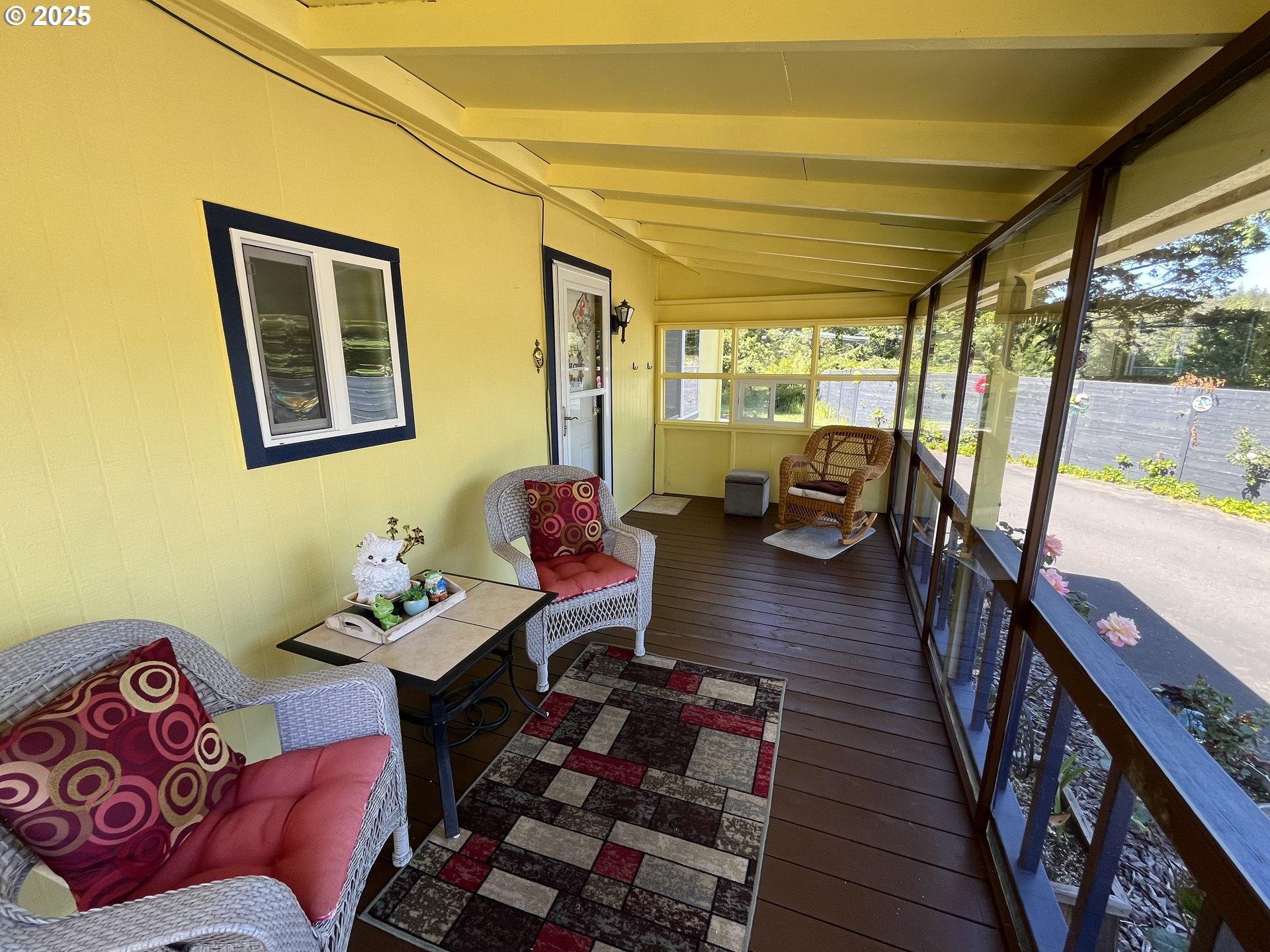 83763 Highway 101, Unit 10 Florence, OR 97439 - Photo 8 of 34 a living room with furniture and a large window